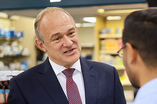Ed Davey speaking to a man