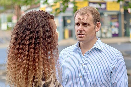 : Luke Taylor MP speaks with a local councillor in Sutton in August